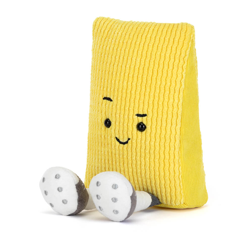 Yellow textured pillow with a smiling face and white paw pads on a white background