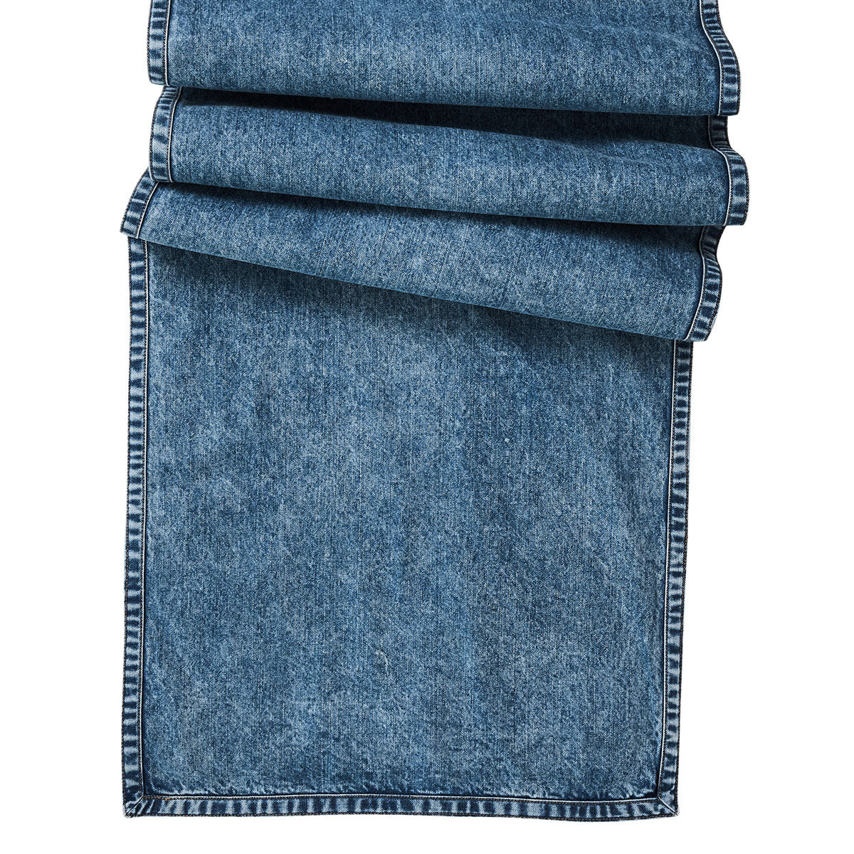 Rolled-up denim fabric on a white background
