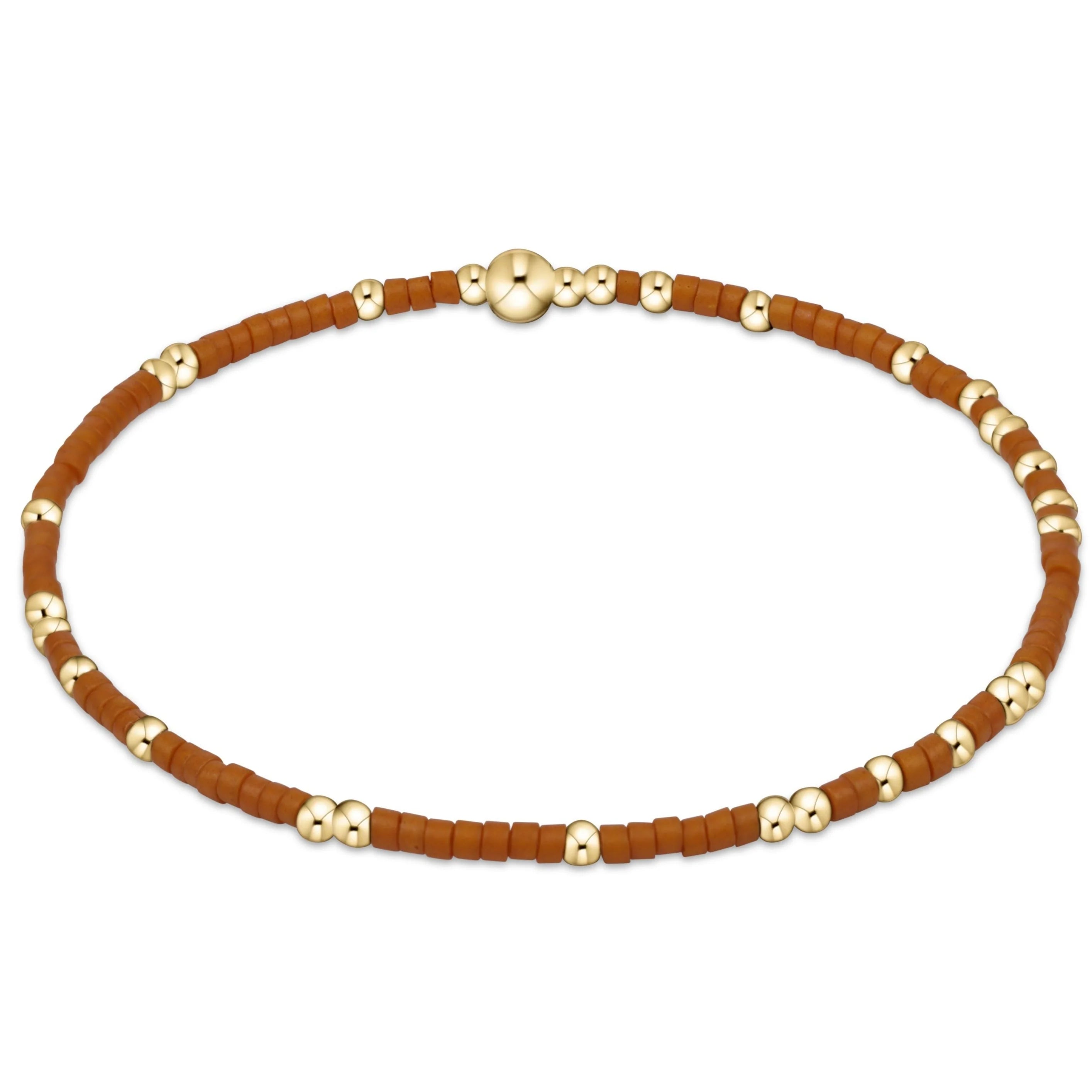 Necklace with brown and gold beads on a white background