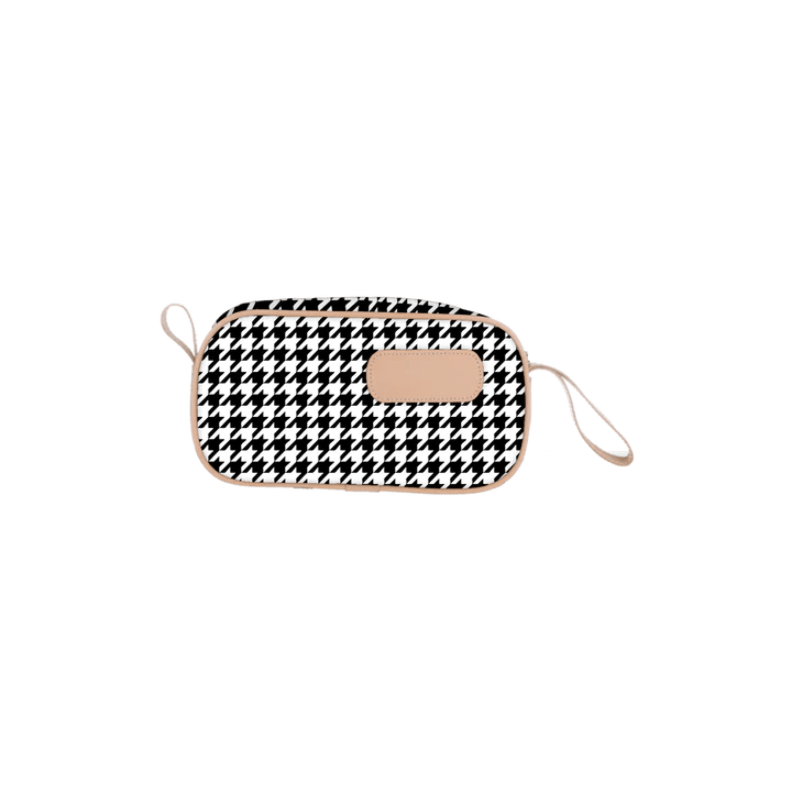 Black and white checkered pouch with beige strap on a white background