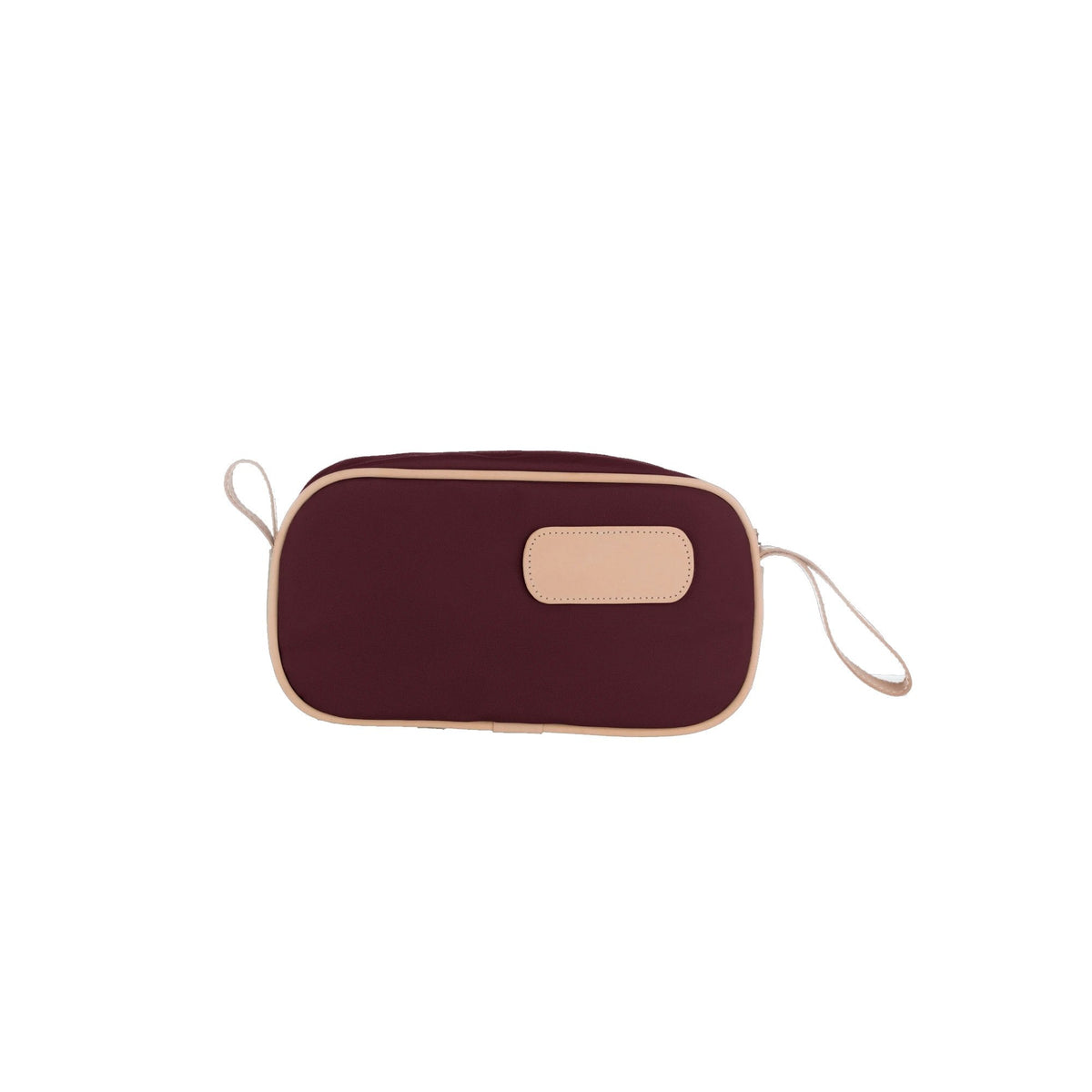 A person holding a black and brown vinyl coated canvas shaving kit with natural leather trim and straps, featuring a zippered closure and the brand name 'Lewis' on the front.